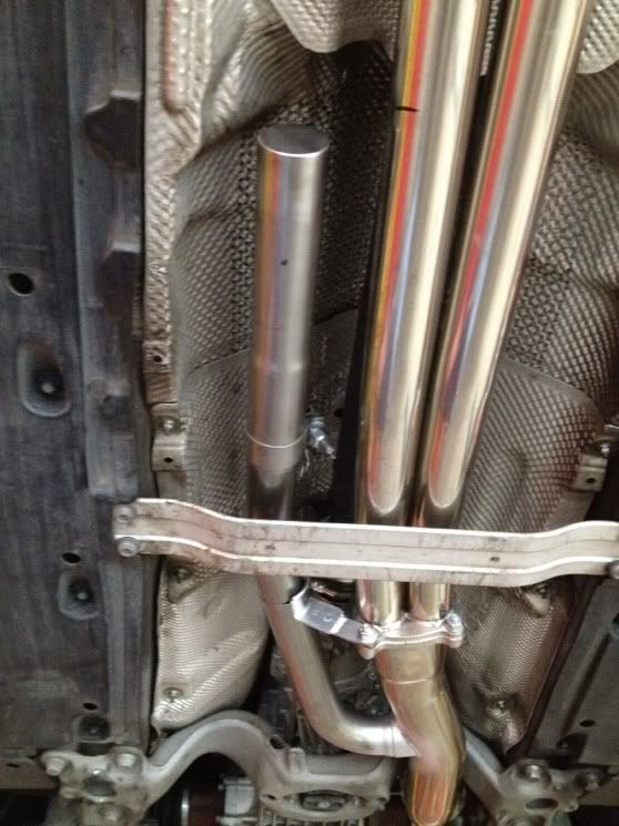 Car at shop, helmholtz resonators being installed.