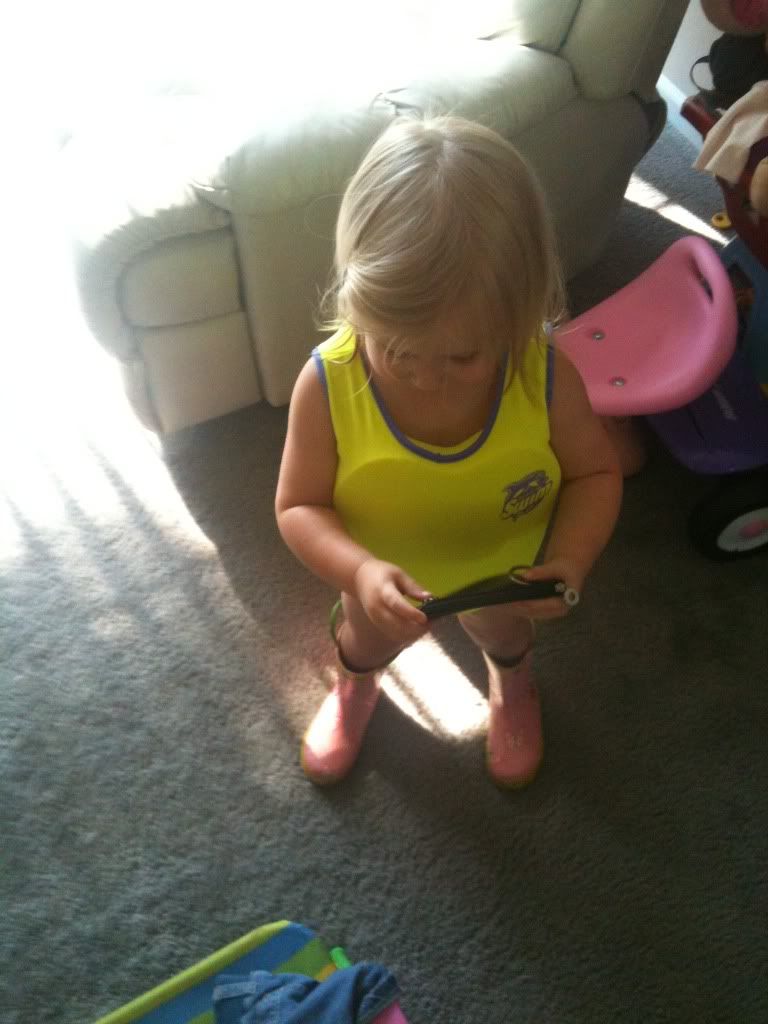 This is my little one in her new swimsuit. Yes, she is wearing rain boots lol